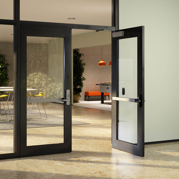photo of pair of modern-looking black steel doors with large single pane of glass leading to a room, one door is open